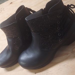 Ankle boots with fancy lacing. Unique and startling in appearance